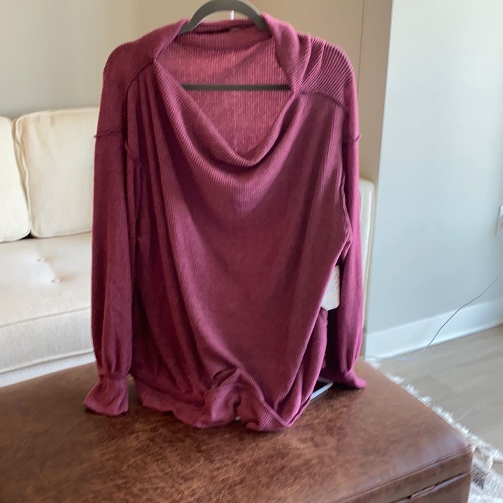 Free People large pinkish/purple sweater.